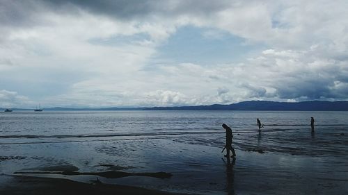 Scenic view of sea against cloudy sky