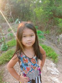 Portrait of girl standing outdoors