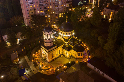 High angle view of illuminated buildings in city at night