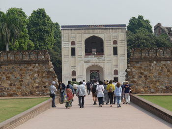 Group of people in front of historical building