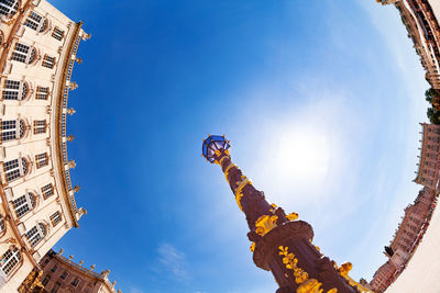 Low angle view of buildings against blue sky