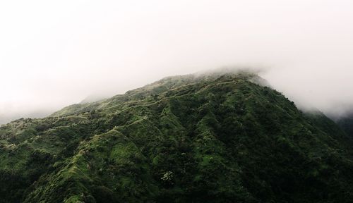 Scenic view of mountains in foggy weather