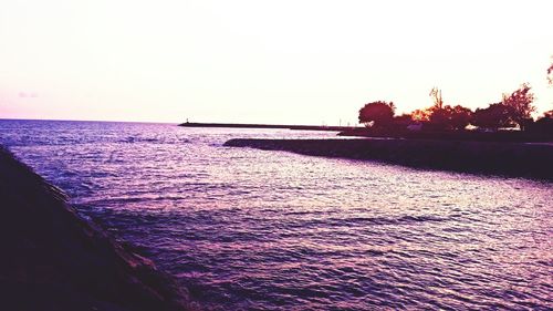 Scenic view of calm sea against clear sky