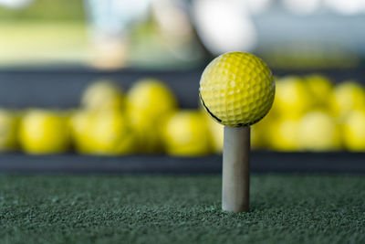 Close-up of golf ball on grass