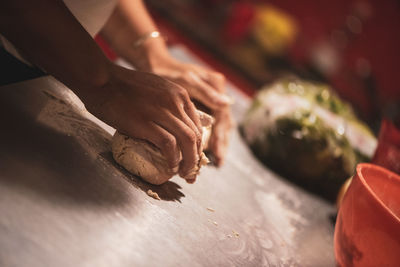 Midsection of person preparing food