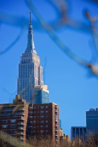 Low angle view of buildings against blue sky