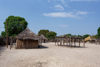 Built structure on beach against sky