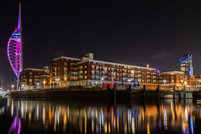 Reflection of buildings in city at night