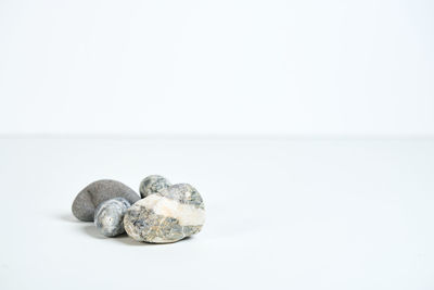 Close-up of stones against white background