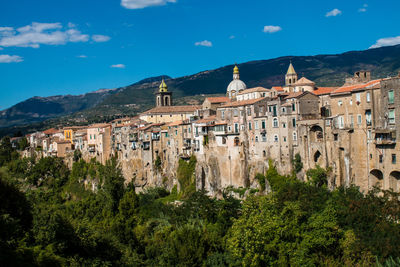 Buildings in city against sky