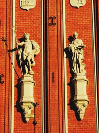 Low angle view of statue against building