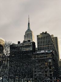 Low angle view of buildings in city against sky