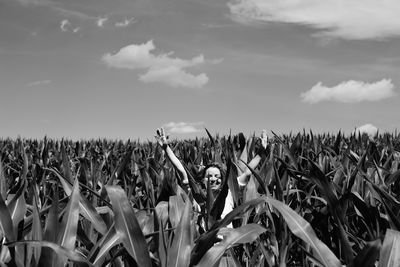 Scenic view of field against cloudy sky