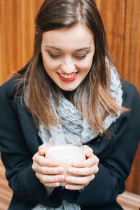 Beautiful young woman drinking drink