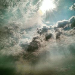 Sun shining through clouds