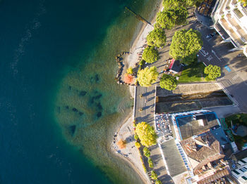 High angle view of swimming pool by building in city