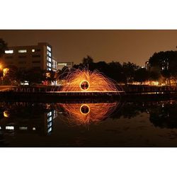 Reflection of illuminated buildings in water at night