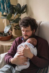 Man and woman sitting at home