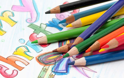 Close-up of colorful pencils on paper 
