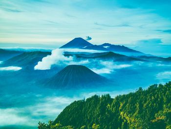 Scenic view of mountains against cloudy sky