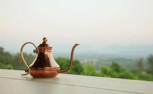 Close-up of teapot on table