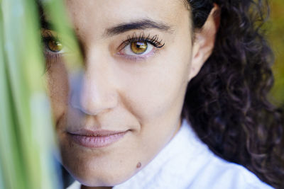 Close-up portrait of smiling young woman