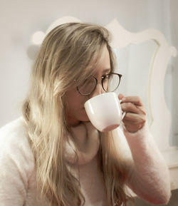 Portrait of woman drinking coffee