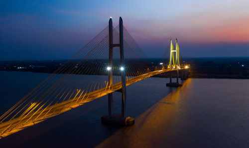 Illuminated suspension bridge over sea