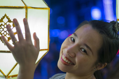 Close-up portrait of a smiling young woman