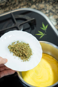 High angle view of person preparing food in bowl