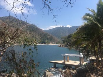 Scenic view of lake and mountains against sky