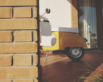 Vintage car on street against wall