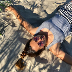 High angle view of woman lying down on floor