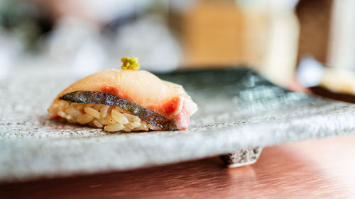 Close-up of sushi served on table