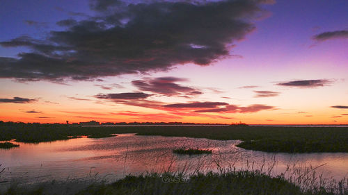 Scenic view of lake against sky during sunset