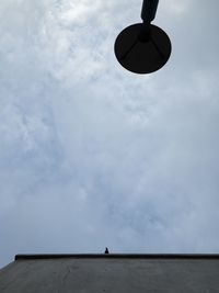 Low angle view of silhouette person against sky