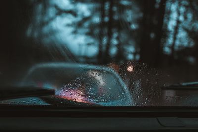 Raindrops on glass window during rainy season