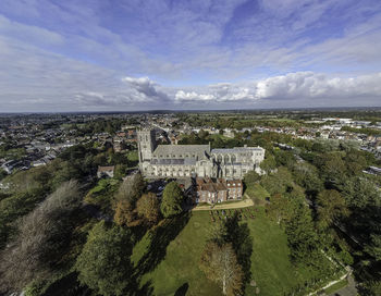 High angle view of trees and buildings in city