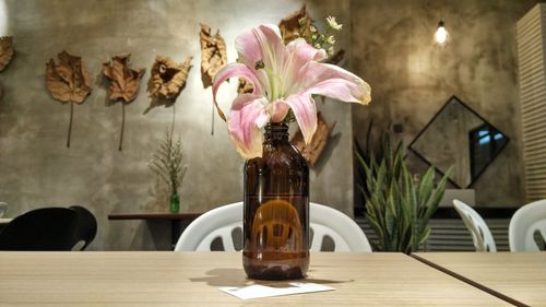 Close-up of flower vase on table