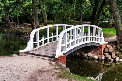 Footbridge over lake in park