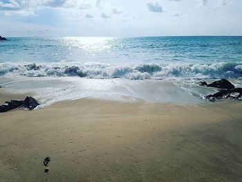 Scenic view of sea against cloudy sky