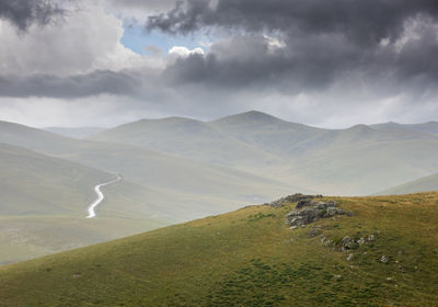 Scenic view of landscape and mountains against sky