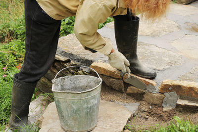 Low section of man working on concrete