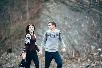 Young couple walking outdoors