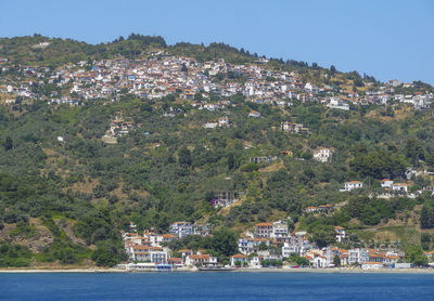 High angle view of townscape by sea