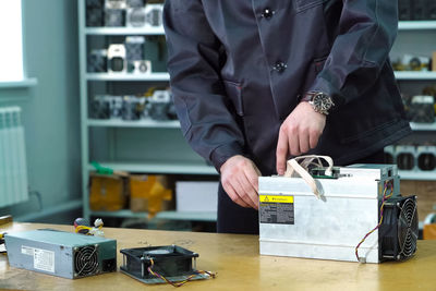 Man working on table at store