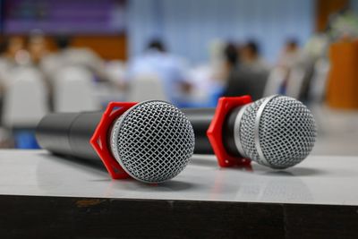 Close-up of microphones on table