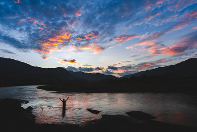 Scenic view of lake against sky during sunset