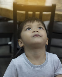 Close-up of boy looking up