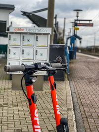 Close-up of bicycle parked on footpath